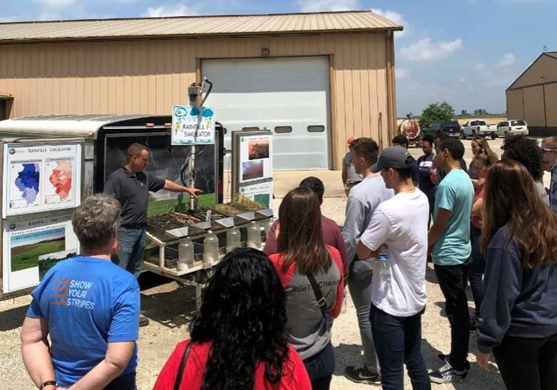 Jim Isermann, demonstrating ISAP's rainfall simulator.